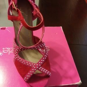 Shoe dazzle hot and red studded heel.8.5